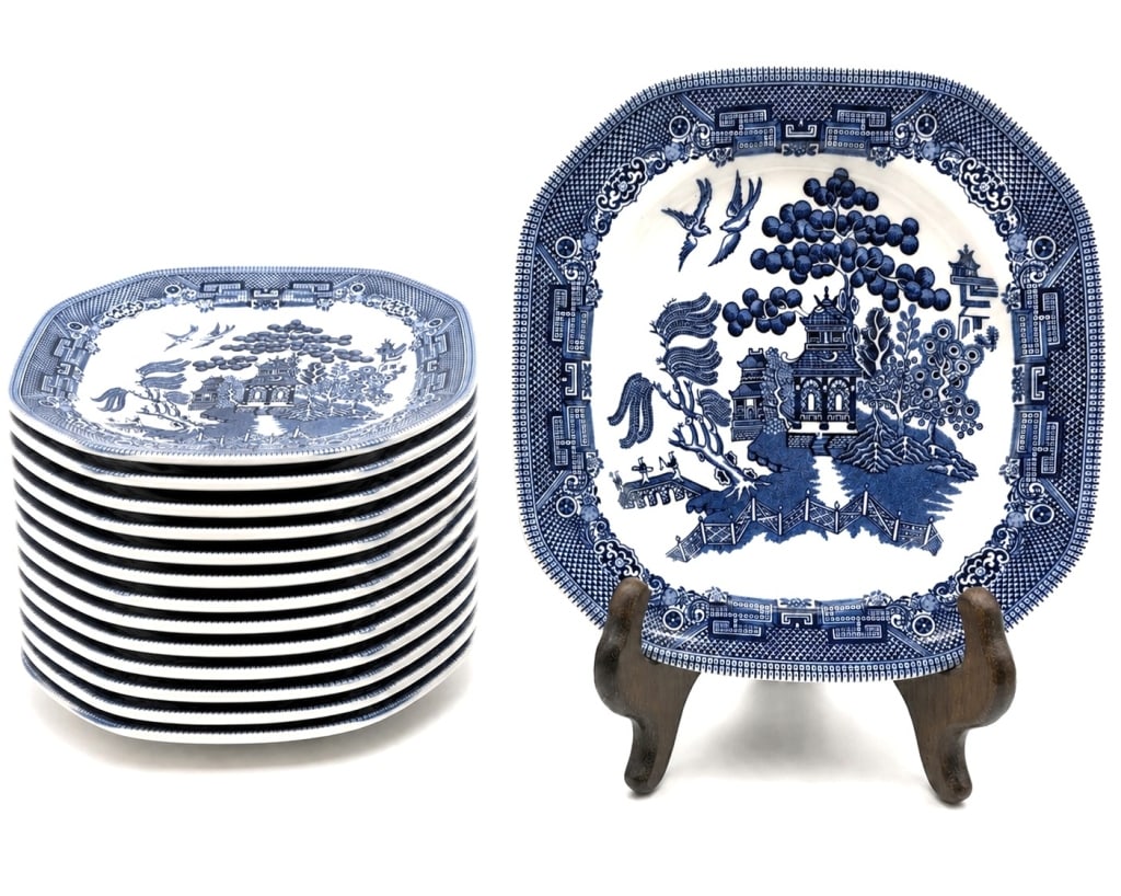 JOHNSON BROS WILLOW 12 SALAD PLATES 8": Set of twelve Johnson Bros. "Willow" blue and white earthenware salad plates, made in England. This classic transferware pattern features the timeless Blue Willow-inspired landscape with pagodas, brid