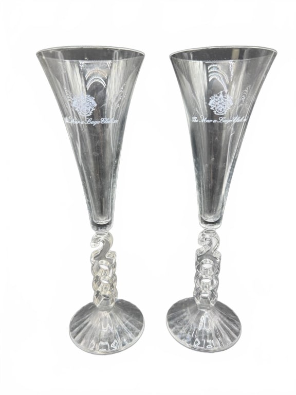 Pair The Queen?s Royal Crystal Flutes: Clear crystal champagne flutes featuring spiral stems and engraved 'The Queen?s Royal Castle' emblems on bowls. Each measures approximately 9.5 inches tall. Elegant commemorative glassware.