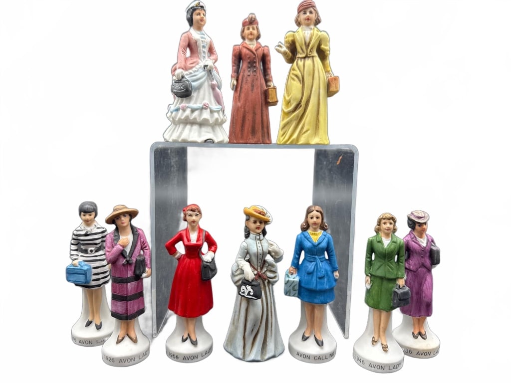 10 Avon Calling Lady Figurines: 10 hand-painted porcelain Avon Calling Lady collectible figurines, each on a labeled base. The figures depict women in various historical fashions. Approximate height ranges to just over 4.5 inches.