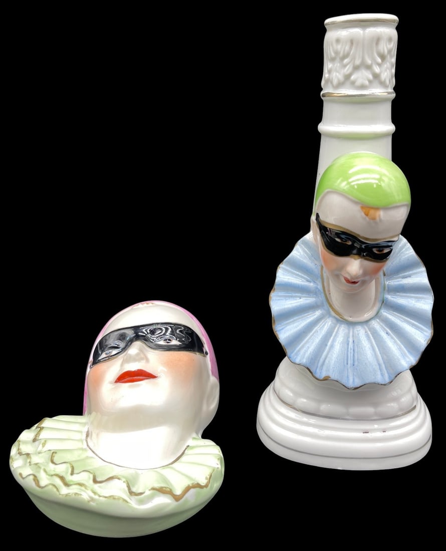 ART DECO PORCELAIN HARLEQUIN LOT 8 IN: This whimsical lot features two Art Deco style porcelain harlequin pieces, including a figural candlestick and a decorative piece, each adorned with masked clown faces and colorful hand-painted accent