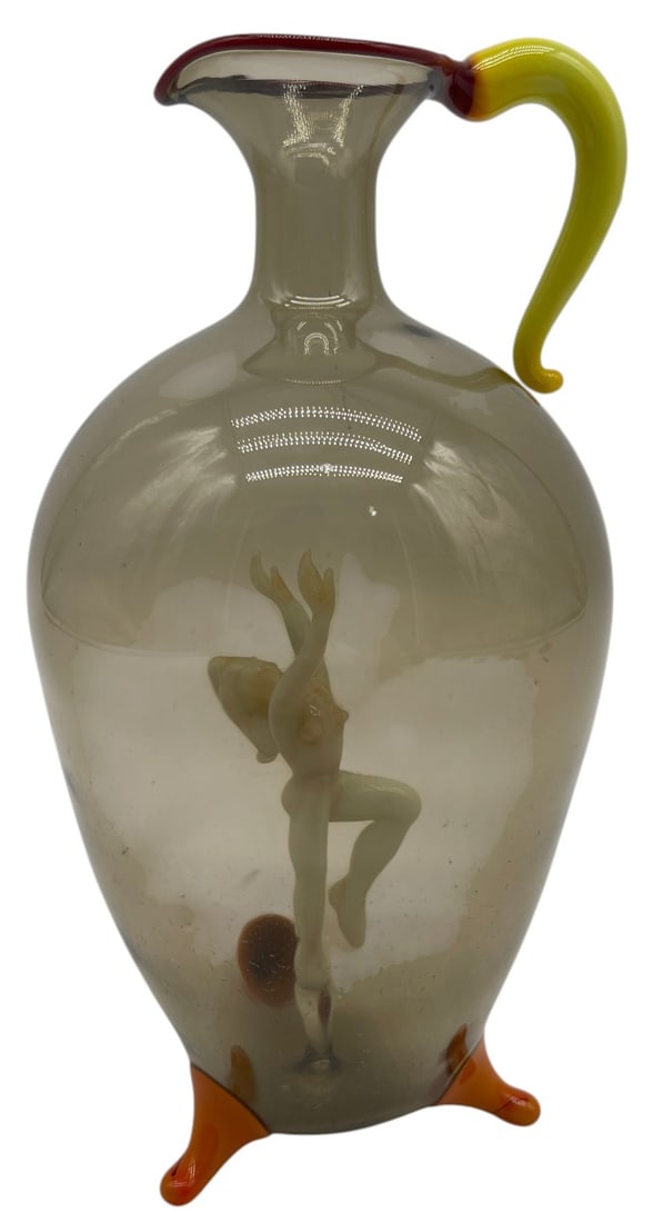 BIMINI FIGURAL ART GLASS DECANTER 6": This elegant attributed Bimini figural art glass decanter features a hand-blown smoky gray body enclosing a finely lampworked dancing female figure suspended within the vessel. The decanter is further