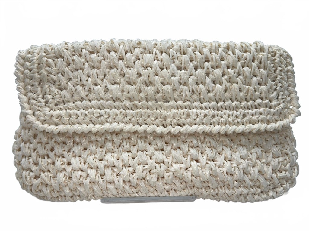 The Broadway Straw Clutch Bag: Handmade woven raffia straw clutch bag labeled 'Expressly for The Broadway Made in Japan' with a fold-over flap and fabric-lined interior. Features inner zip pocket with original label. Neutral cream 