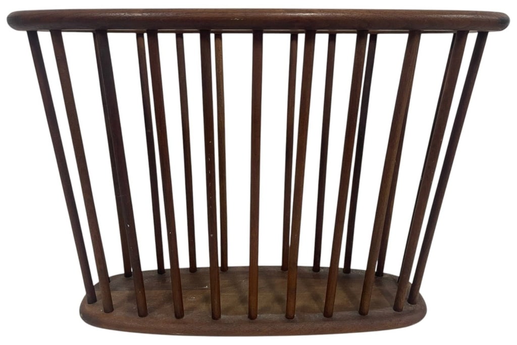 MID-CENTURY WALNUT MAGAZINE RACK 20": This sculptural mid-century walnut magazine rack features a gracefully curved silhouette with evenly spaced vertical slats and a warm walnut finish. Its minimalist organic design complements Mid-Centu