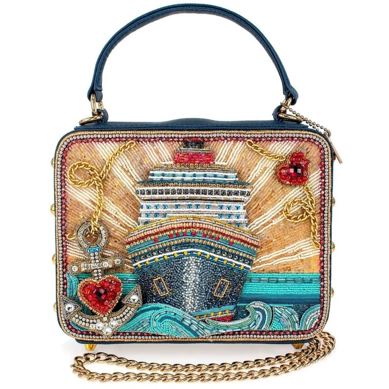 NEW MARY FRANCES FULL STEAM AHEAD BAG: The 'Full Steam Ahead' handbag takes you on a glamorous voyage with its intricately beaded cruise ship design and sparkling ocean waves. With bold nautical elements like a jeweled anchor and radiant s