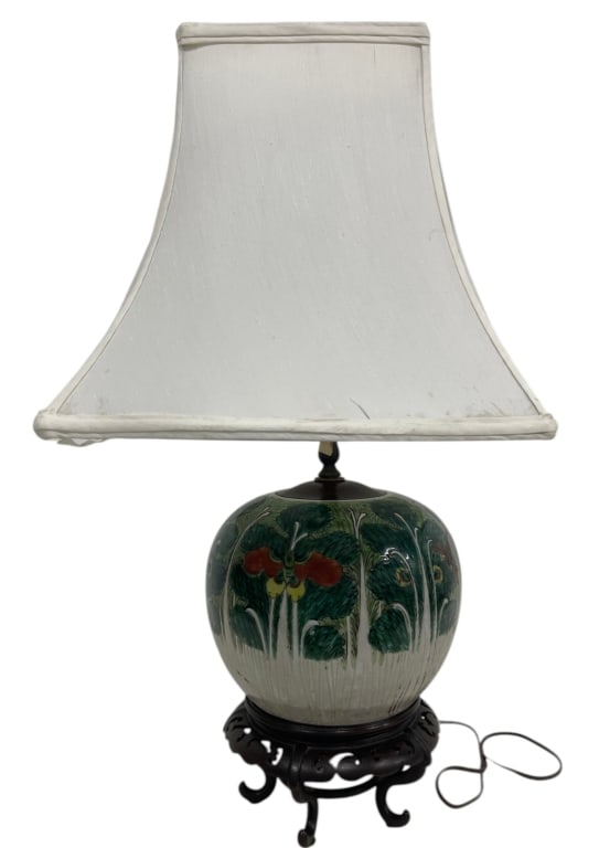 CHINESE HAND-PAINTED CERAMIC TABLE LAMP 26": Decorative hand-painted ceramic table lamp featuring a rounded globe-form body adorned with stylized floral and foliage motifs in rich green, red, yellow, and white tones. The lamp is mounted on an or
