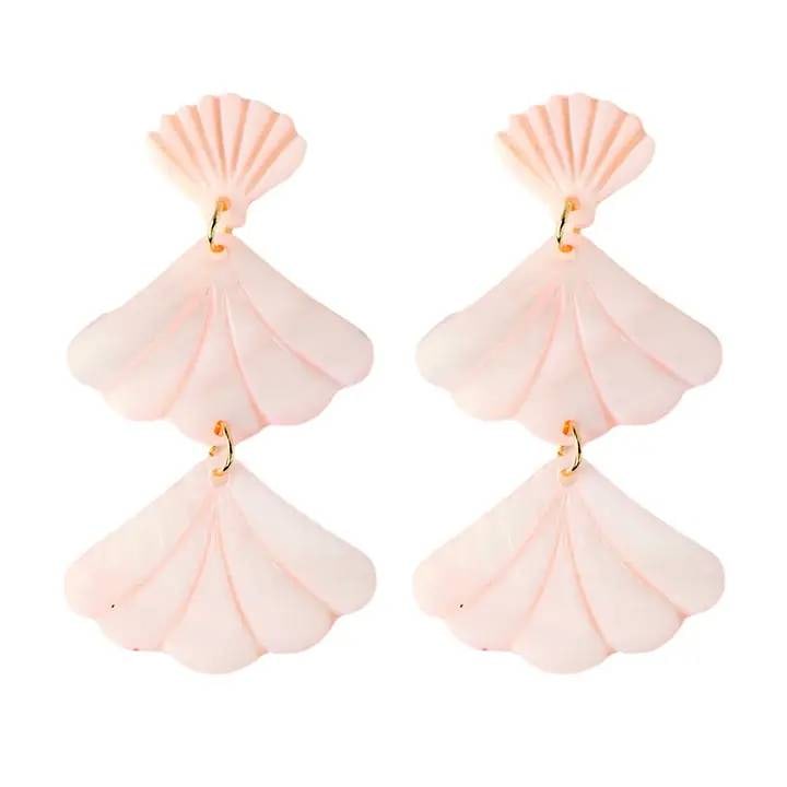 PINK MERMAID SHELL EARRINGS: Cascading pink pearlized shells are grouped together to create a distinctively 'old Florida' look! Lightweight and perfect for Summer. | | ? 2.75" Length | ? Faux Pink Mother of Pearl | ? Shell Motif 