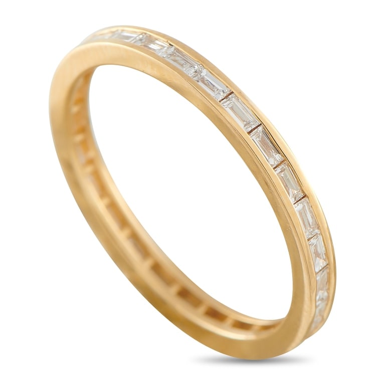 18K YELLOW GOLD 0.40CT DIAMOND ETERNITY BAND RING: This eternity band ring exudes quiet luxury. Set in 18K Yellow Gold, the classically elegant design comes complete with a series of sparkling Diamonds totaling 0.40 carats. It measures 2mm wide and fe