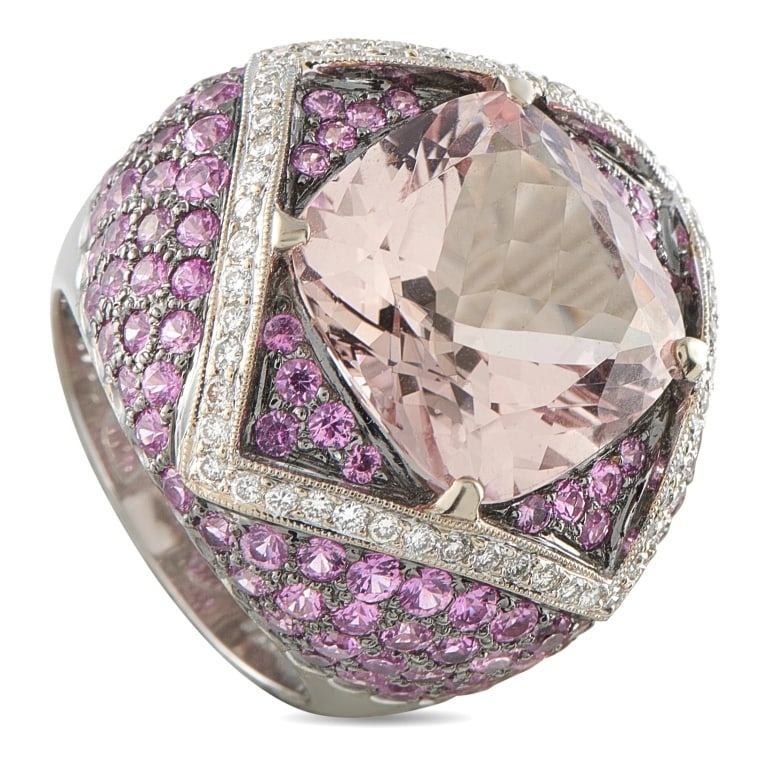 18K GOLD, DIAMOND, MORGANITE, & SAPPHIRE RING: This luxury ring beautifully combines colors, textures, and luxury materials. The dynamic design features sparkling Diamond accents totaling 0.48 carats and Pink Sapphires totaling 4.67 carats. A 9.86
