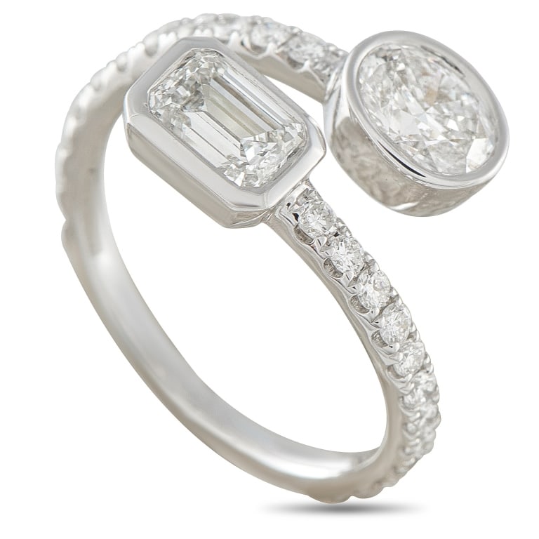 18K WHITE GOLD 1.95CT DIAMOND BYPASS RING: This bypass ring is ideal for anyone who appreciates understated luxury. The charming 18K White Gold setting wraps around the finger and is bookended by sparkling Diamonds totaling 1.50 carats. Additi