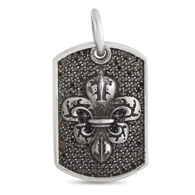 KING BABY SILVER AND BLACK DIAMOND FLEUR-DE-LIS RE: This King Baby dog tag pendant is made of silver and embellished with black diamonds. The pendant measures 1.5 in length and 1 in width.Offered in brand new condition, this item includes the manufactu