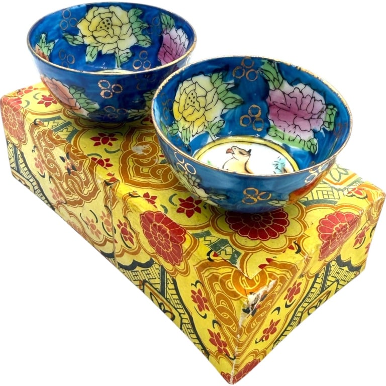 JAPANESE PORCELAIN ZODIAC MINI BOWLS PAIR 2": Pair of vintage Japanese porcelain bowls featuring vivid cobalt blue grounds with hand-painted peony blossoms, green foliage, gilt accents, and gilt rims. The central medallions depict a horse and ox 