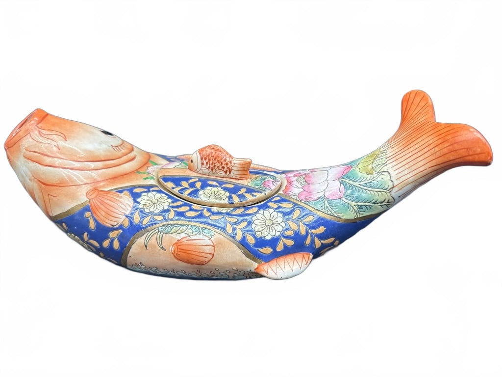 Japanese Kutani Fish-Form Porcelain Vessel: Japanese Kutani porcelain vessel in the shape of a fish with removable lid, hand-painted with floral and aquatic motifs. Marked on base. Approximate length shown alongside ruler for reference.