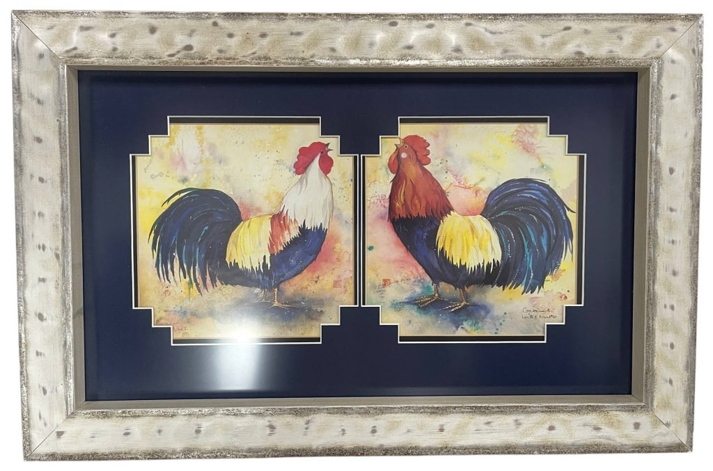 FRAMED ROOSTER PRINTS DECOR 23": This decorative framed artwork features a pair of vibrant rooster prints displayed within a single presentation mat and finished with a distressed silver-tone frame. The colorful farmhouse-inspired co