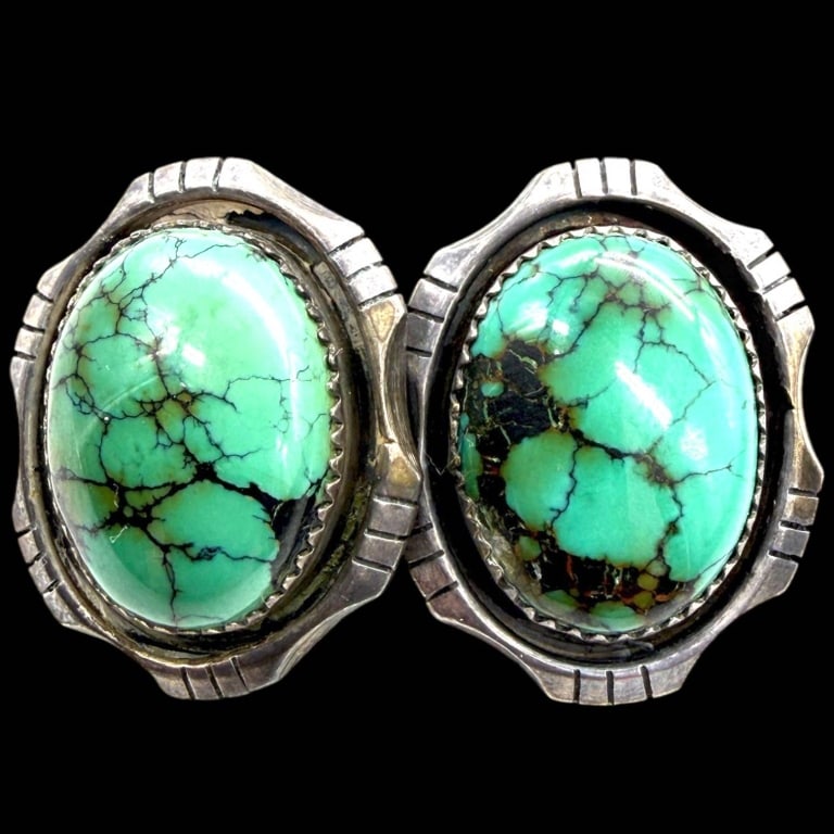 STERLING TURQUOISE CLIP-ON EARRINGS 1": Beautiful vintage sterling silver clip-on earrings featuring a matched pair of vibrant oval turquoise cabochons with striking natural black matrix veining. Each stone is securely bezel set within a bo