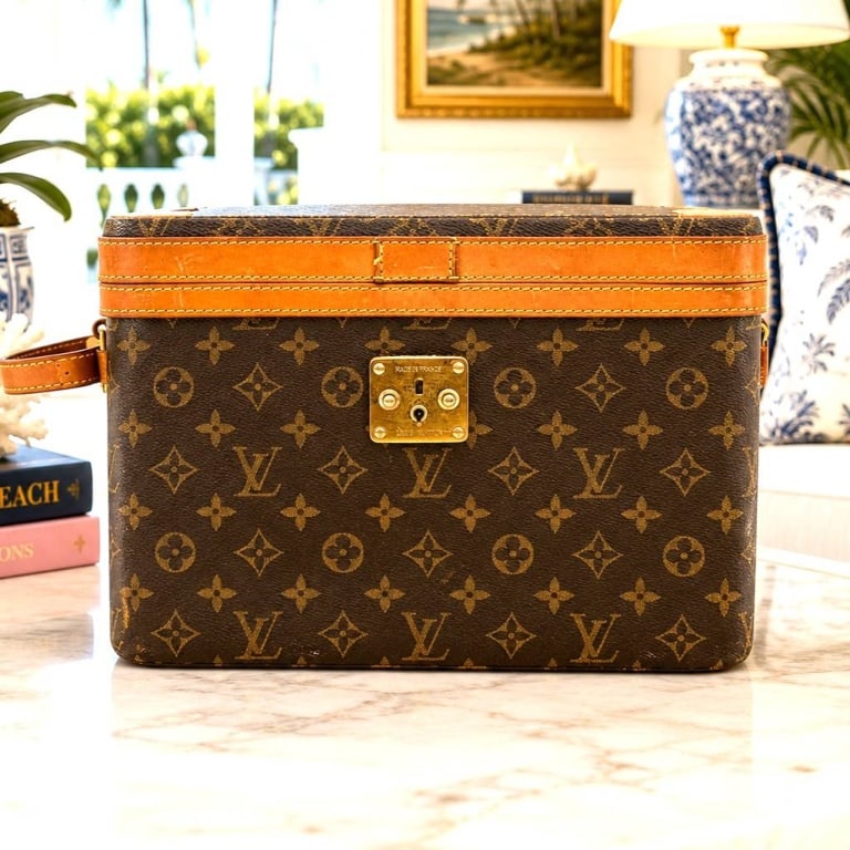 LOUIS VUITTON HARD SIDED MONOGRAM TRAIN CASE 12": A vintage Louis Vuitton Monogram Canvas hard-sided train case showcasing the Maison's iconic coated canvas with natural vachetta leather trim, reinforced corners, leather side handle, and brass lock h