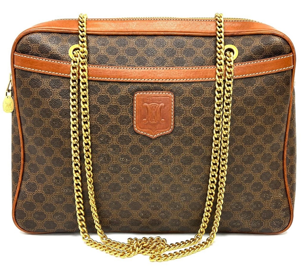 CELINE MACADAM CHAIN SHOULDER BAG 13": This vintage Celine shoulder bag is crafted in the iconic Macadam coated canvas with brown leather trim and elegant gold-tone chain shoulder straps. The structured silhouette features the classic Trio