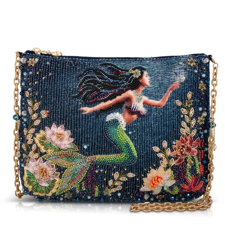 NEW MARY FRANCES MERMAID MAGIC BAG: Immerse yourself in a true piece of wearable art with this exquisitely detailed beaded crossbody. A graceful mermaid glides through richly detailed underwater florals, each bead thoughtfully placed to