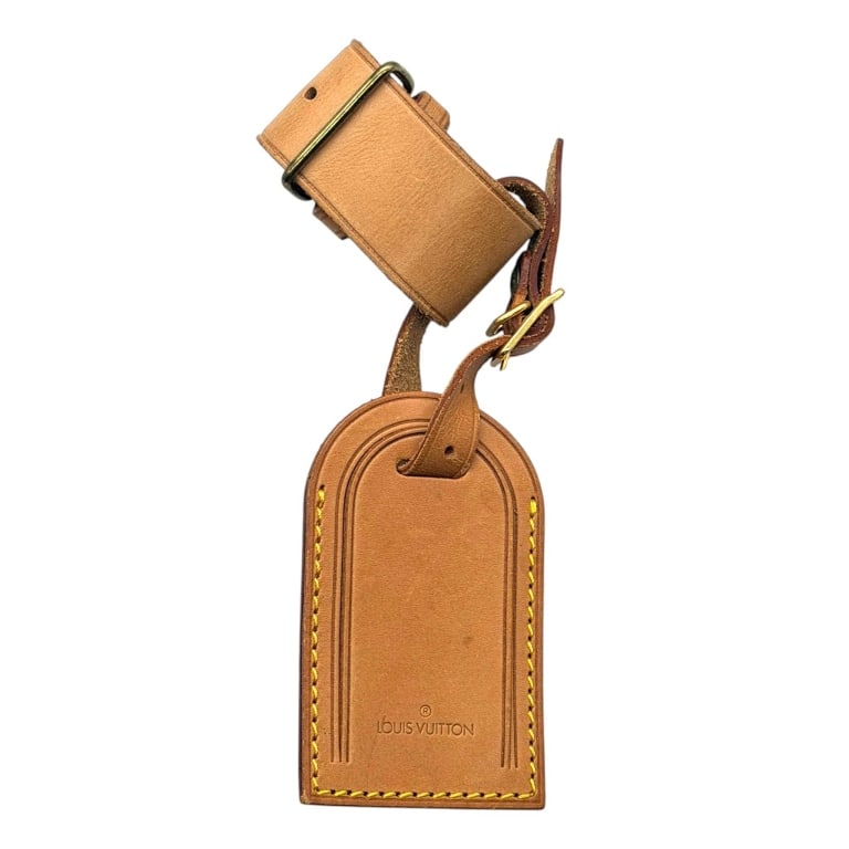 LOUIS VUITTON LUGGAGE TAG SET 7": Louis Vuitton natural vachetta leather luggage tag and adjustable handle holder set, handcrafted in France. Designed to accompany Louis Vuitton travel luggage, this matching accessory set features the