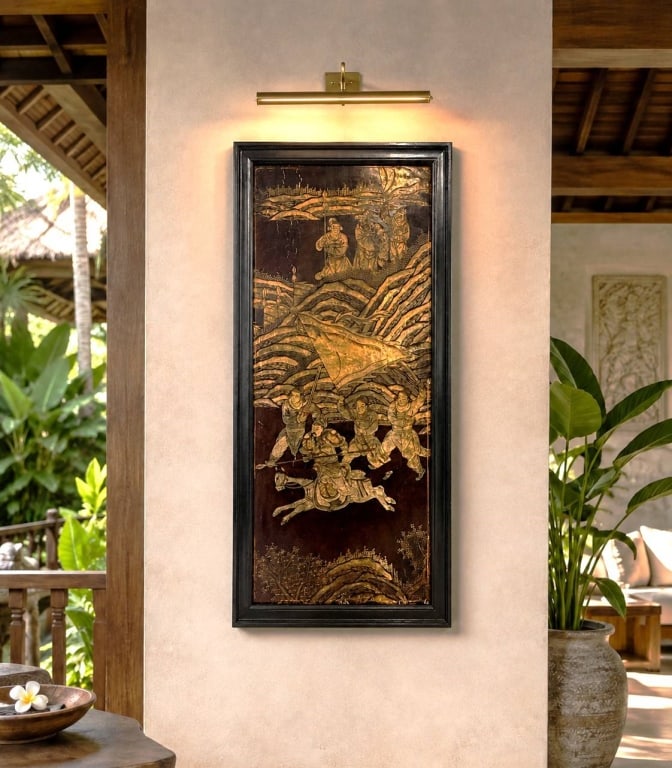 REPURPOSED HAND CARVED ASIAN WOOD PANEL 39": Asian carved and lacquered wood panel depicting mounted warriors and attendants beneath a sweeping banner, with layered mountains, trees, and architectural elements rendered in warm gold, brown, red, 