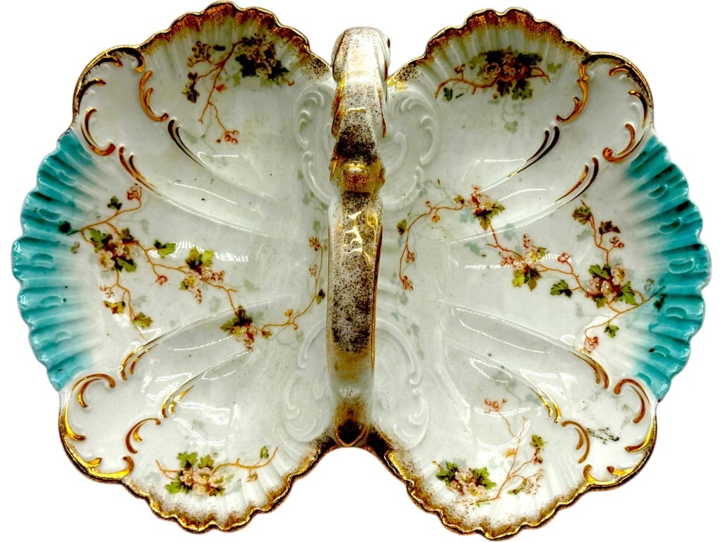KPM PORCELAIN DOUBLE DISH 12": Elegant antique KPM Germany porcelain double serving dish featuring two shell-form bowls joined by an ornate scroll handle. Beautifully decorated with delicate pink floral garlands, embossed Rococo-st