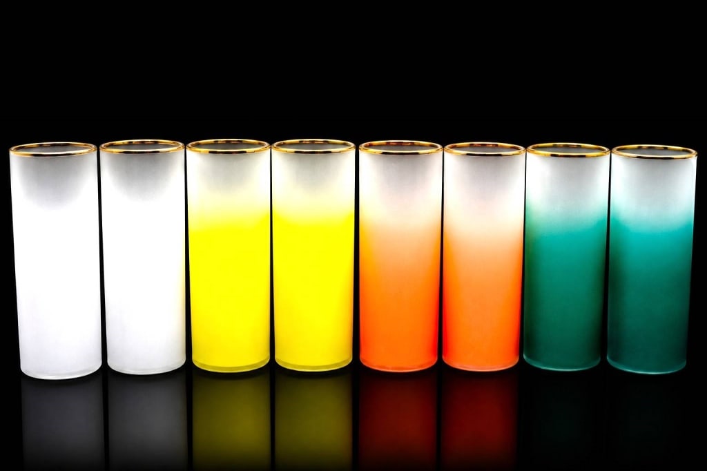NORTHWOOD FROSTED OMBRE GLASS TUMBLERS 8PC 7": A set of eight vintage Northwood frosted art glass tumblers featuring a soft ombr? color fade with gilt rims in coordinating white, yellow, coral, and emerald green. Each tumbler bears the embossed No