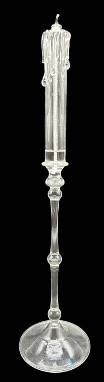 HAND-BLOWN DRIP WAX GLASS CANDLESTICK 17": Elegant hand-blown clear art glass candlestick featuring a dramatic simulated dripping wax candle design with applied molten glass drips cascading from the top. The tall baluster-form stem rises from 
