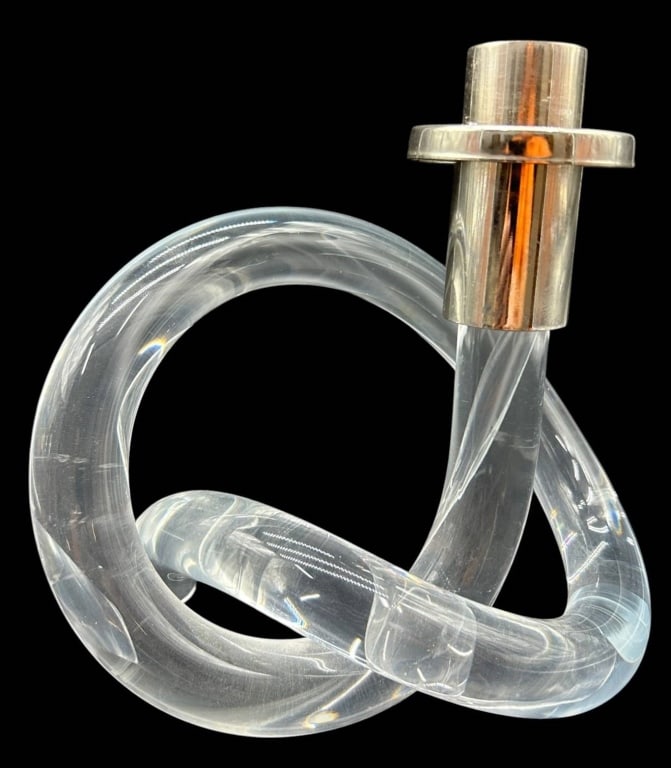MODERN LUCITE LOOP CANDLESTICK 7": Contemporary sculptural Lucite candlestick featuring an intertwined loop design with a polished chrome-tone candle cup. The clear acrylic construction creates a striking optical effect while the flowi
