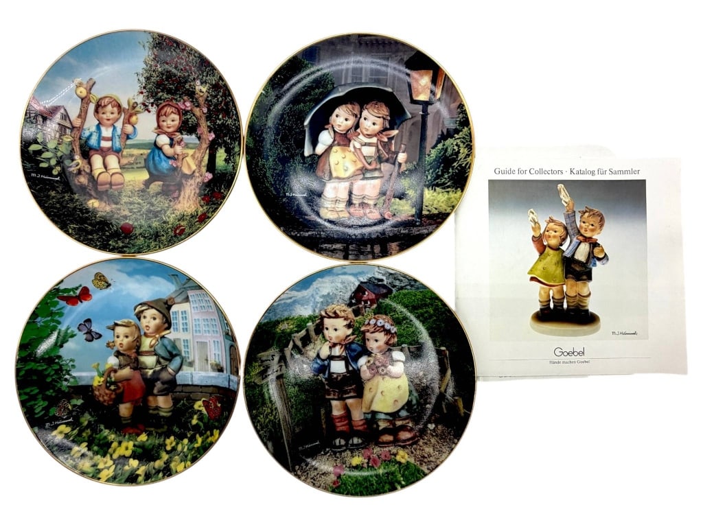 M.J. HUMMEL COLLECTOR PLATES & GUIDES 8": Collection of four M.J. Hummel decorative porcelain plates from the ?Little Companions? series, each featuring beloved Hummel children in richly colored outdoor scenes with gilt-finished rims. The gro