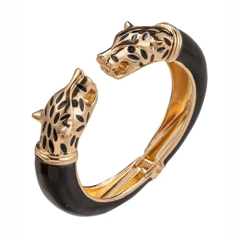 NEW EYE CANDY LEOPARD CUFF BRACELET: Add some ferocity to our look with this powerful cuff bracelet! Twin leopard heads meet at the base of the cuff and are signified by glass crystals to give this cuff bracelet the perfect balance betwe