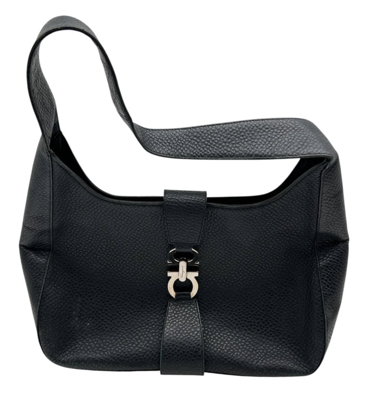 SALVATORE FERRAGAMO BLACK LEATHER HOBO 13": A timeless Salvatore Ferragamo black pebbled leather hobo shoulder bag featuring the iconic polished Gancini front clasp. Crafted in Italy, this elegant everyday handbag offers a spacious open interio