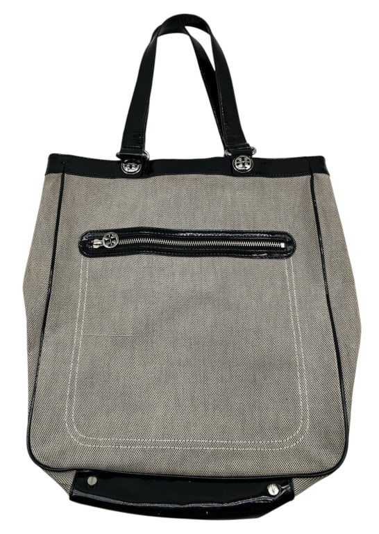 TORY BURCH CANVAS & PATENT LEATHER TOTE 15": Classic Tory Burch tote handbag featuring durable beige canvas with black patent leather trim, dual shoulder straps, exterior zip pocket, polished silver-tone logo hardware, and a spacious open interi