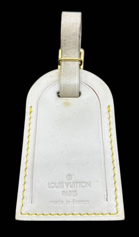 LOUIS VUITTON VACHETTA LUGGAGE TAG 5": Authentic Louis Vuitton natural vachetta leather luggage tag embossed "LOUIS VUITTON PARIS made in France." Features gold-tone hardware and the classic blank identification panel. Displays a naturally