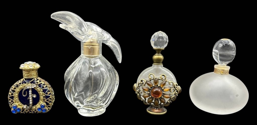 VINTAGE PERFUME BOTTLE COLLECTION 4": An elegant collection of four vintage decorative perfume bottles showcasing a variety of styles and materials. This assortment includes an ornate cobalt blue and gilt perfume bottle accented with rhin