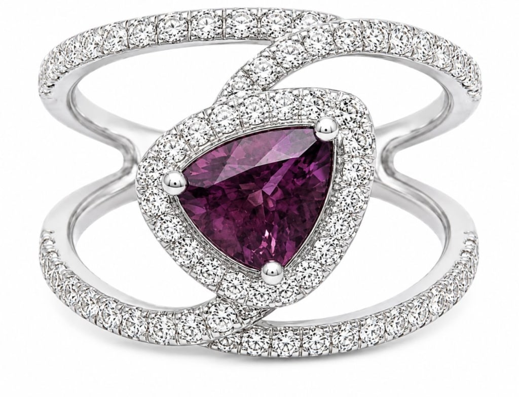 GIA OSCAR FRIEDMAN PLATINUM & SAPPHIRE RING 8.4G: Platinum ring by Oscar Friedman featuring a GIA-certified unheated natural sapphire weighing 1.46 carats in a triangular modified brilliant cut. The pinkish-purple sapphire is surrounded by approximat
