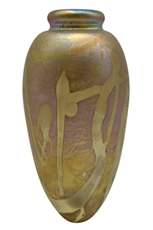 ROBERT EICKHOLT IRIDESCENT ART GLASS VASE 5": Robert Eickholt studio art glass vase featuring a softly iridescent gold, champagne and pale lavender surface with flowing abstract pulled and applied decoration. The rounded elongated form has a smal