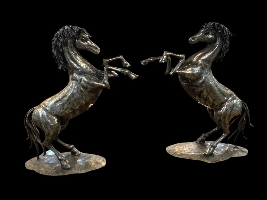 PAIR METALWORK HORSES ART SIGNED SILVANO SALVADOI: Signed by artist and exquisite metalwork art for the pair. Both horses on stabilizing stand in reared condition as if playing with one another or asserting dominance. Deep silver colored metal likely 
