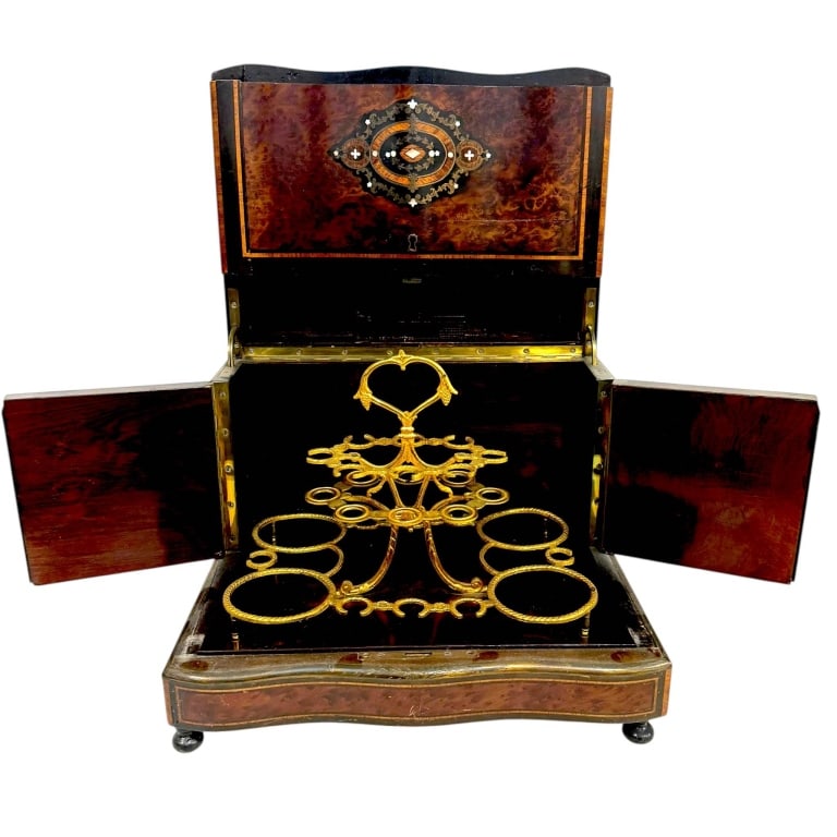 NAPOLEON III 19TH CENT AMBOYNA CAVE ? LIQUEUR 11": Fine 19th-century French Napoleon III cave ? liqueur or liquor cabinet crafted in richly figured burl wood veneer with ebonized borders, fine contrasting string inlay, brass decoration and mother-of-p