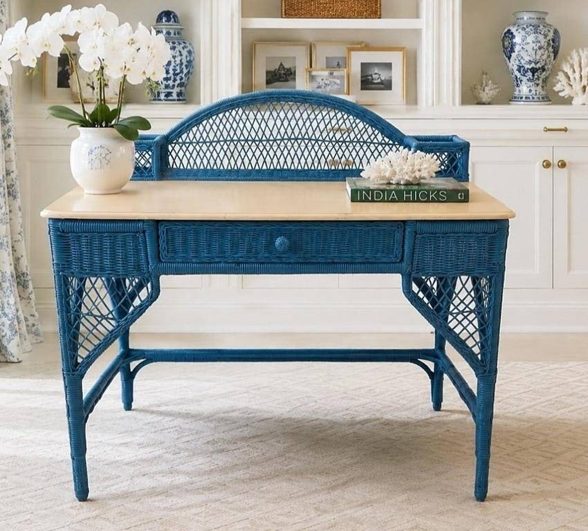 VINTAGE BLUE WICKER DESK WITH DRAWER: Charming vintage wicker desk in blue, featuring a single center drawer and an elegant openwork back. The desk offers decorative appeal and practical workspace, perfect for a sunroom, bedroom, or offic