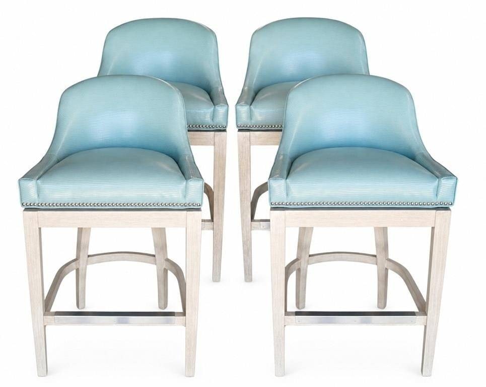 SWIVEL COUNTER BAR STOOL CHAIRS: Set of four contemporary counter stools featuring curved barrel backs upholstered in aqua blue textured faux leather with nailhead trim. The stools rest on light cerused wood frames with metal