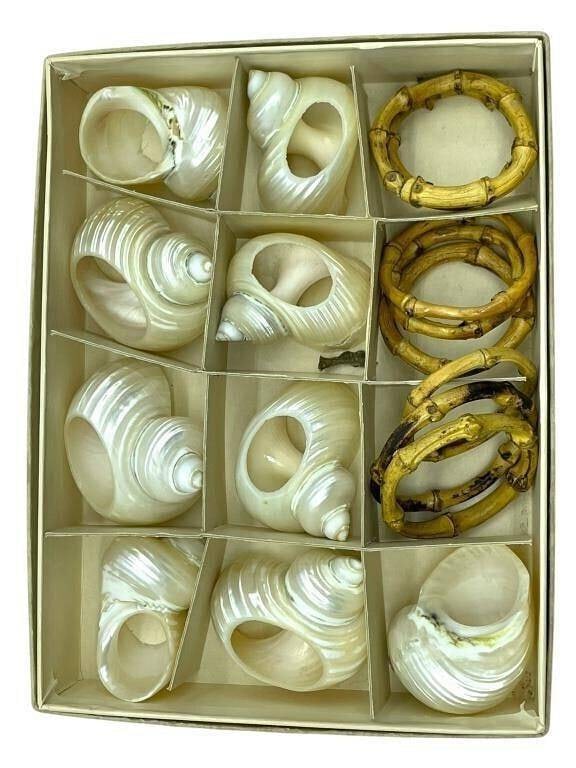 VINTAGE SHELL AND BAMBOO NAPKIN RINGS IN BOX: SET OF SHELL AND BAMBOO NAPKIN RINGS IN ORIGINAL BOX | -Very good pre owned condition | -Each piece showcases organic texture and form, making them a perfect coastal, tropical, or rustic dining accent