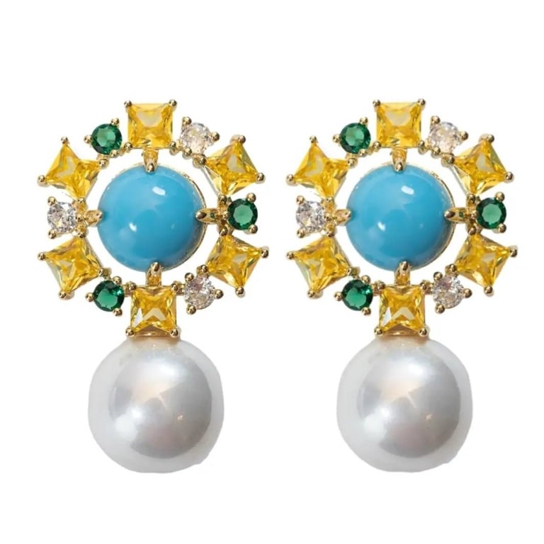 PALM BEACH GLAM VINTAGE EARRINGS: Inspired by the glamorous style of Palm Beach, these vintage-inspired statement earrings feature vibrant yellow and green gemstones surrounding a bright turquoise center stone, with a lustrous faux pe