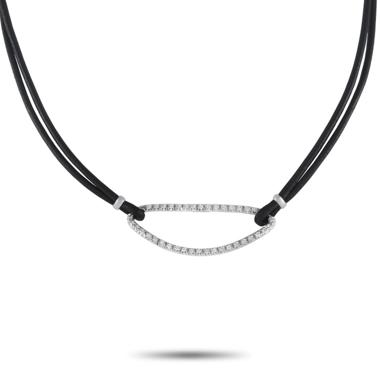 PIERO MILANO 18K GOLD 0.72CT DIAMOND NECKLACE: A must-have for an edgy wardrobe. Don this black cord and diamond choker necklace and nail the rock-chic look. This Piero Milano necklace features a 14-inch black cord necklace holding a sculpted oval