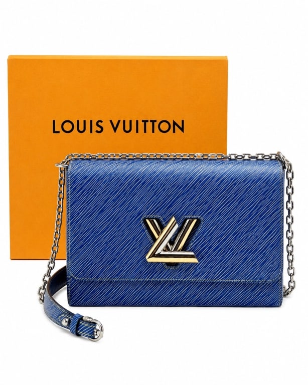 LOUIS VUITTON TWIST PM EPI LEATHER SHOULDER BAG 9": Never-worn Louis Vuitton Twist PM shoulder bag crafted in vibrant blue Epi leather and featuring the house's iconic LV Twist lock closure in polished silver-tone hardware. Introduced under the creativ