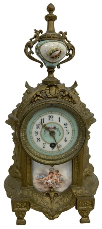 H&H FRENCH METAL & PORCELAIN MANTEL CLOCK 13.75": This decorative late 19th to early 20th century H&H French-style mantel clock features an ornate gilt metal case adorned with scrolling foliate decoration, architectural detailing, and hand-painted po