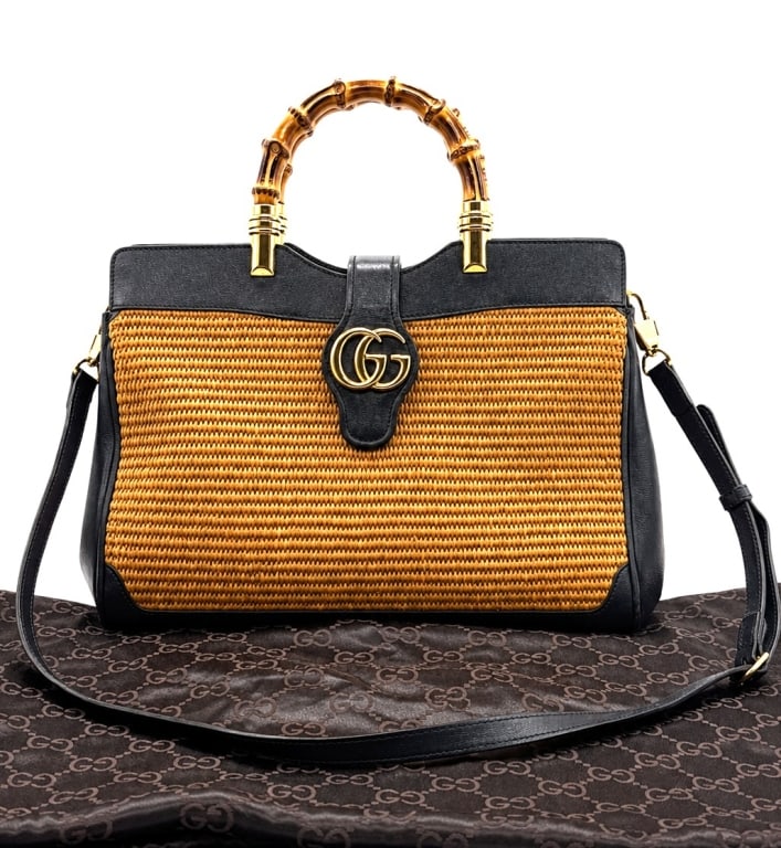 GUCCI DAHLIA BAMBOO TOP HANDLE BAG 12": A striking and exceedingly rare Gucci Dahlia top handle bag crafted in woven natural raffia with black leather trim, signature bamboo handles, and gold-tone Double G hardware. This sought-after Japan 