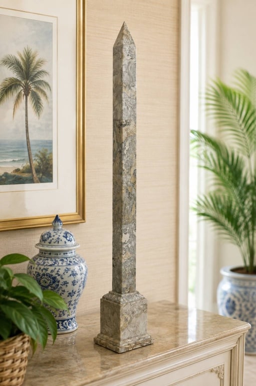 MAITLAND-SMITH MARBLE OBELISK 30": Elegant decorative obelisk by Maitland-Smith, crafted in the Philippines from richly figured polished stone/marble in warm cream, beige, gray and subtle blush tones. The tall tapered column terminates