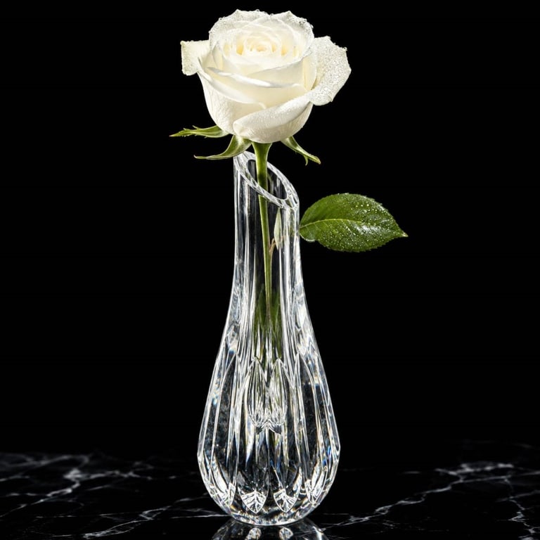 BACCARAT SIGNED CUT CRYSTAL FLOWER VASE 7": Elegant vintage Baccarat French crystal flower vase featuring a tall, slender form with an angled opening and substantial teardrop-shaped base. The lower body is beautifully cut with elongated leaf