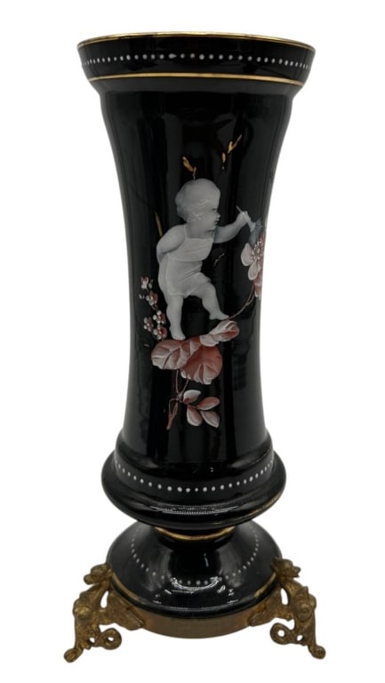 ANTIQUE BLACK GLASS CHERUB VASE BRONZE MOUNTS 9.5": Elegant antique black glass decorative vase featuring a hand-painted or enameled figural scene of a cherub or putto among flowering branches. The glossy black body is accented with delicate white dott