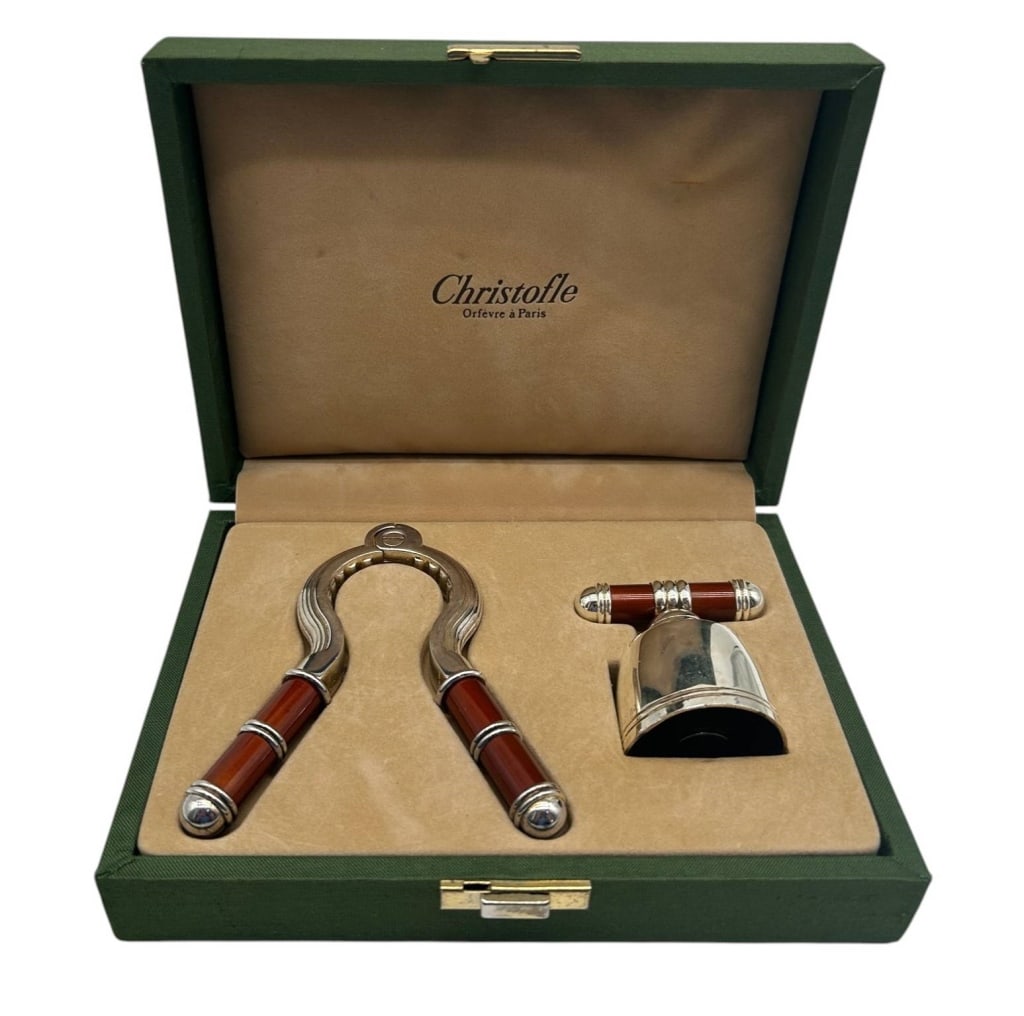 CHRISTOFLE SILVERPLATE BAR TOOL SET IN BOX 7.5": Elegant Christofle Orfevre a Paris boxed bar accessory set featuring a silverplate nutcracker and coordinating bottle stopper/cork accessory, each accented with rich reddish-brown handles and polished