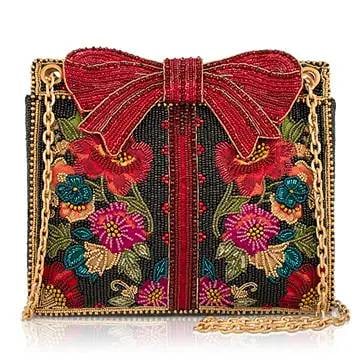 NEW MARY FRANCES FLORAL BOW BAG: Every day deserves a little something special. Gifted is a floral handbag adorned with a dramatic crimson bow, vibrant blossoms, and rich jewel tones that transform an everyday accessory into an unfor